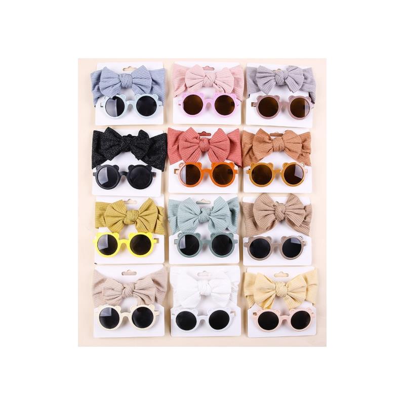 Baby sunglasses and coordinating headbands in various colors arranged in a grid, showcasing styles and details.