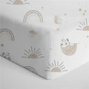 100% cotton crib fitted sheet featuring playful sloth and rainbow patterns in soft, neutral colors.