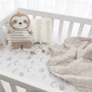 Cotton jersey crib fitted sheet featuring rainbow sloths, with a plush sloth toy, decorative pillow, and soft blanket.