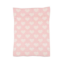 Chenille baby blanket in pink with a pattern of white hearts, designed for warmth and comfort.