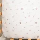 Cotton jersey fitted sheet featuring a honey pot and floral design in muted colors. Ideal for bedding.