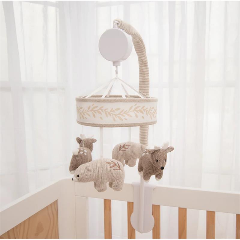 Musical mobile featuring soft plush bear and deer toys, designed for a crib, with a light-colored floral band.