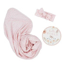 Newborn Hello World Gift Set featuring a pink gingham swaddle, matching headband, and a floral milestone disc.
