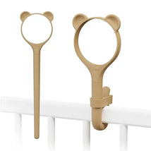 Exchangeable outer sleeve for Lollipop, featuring a bear design; attaches securely to a crib railing.