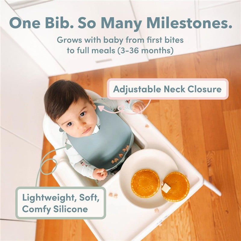 Silicone bib on a baby in a high chair, featuring adjustable neck closure and claims of being lightweight and comfy.