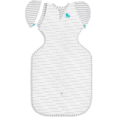 Love To Dream Dreamer Swaddle Up Transition Bag, featuring a white fabric with gray handwriting patterns and striped gray arm wings.