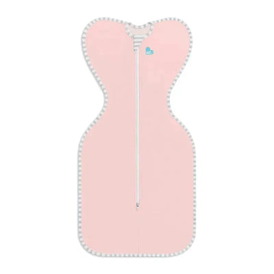 Dusty pink Love To Dream Swaddle Up with a zipper and striped trim, designed for comfortable baby swaddling.