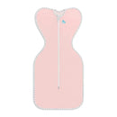 Dusty pink Love To Dream Swaddle Up with a zipper and striped trim, designed for comfortable baby swaddling.
