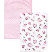 Interlock cotton swaddle blankets featuring a pink polka dot design and a floral pattern with pink roses.