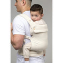 Mabe Monarch Carrier in Natural Ivory, worn by a man carrying a child on his back, both looking at the camera.