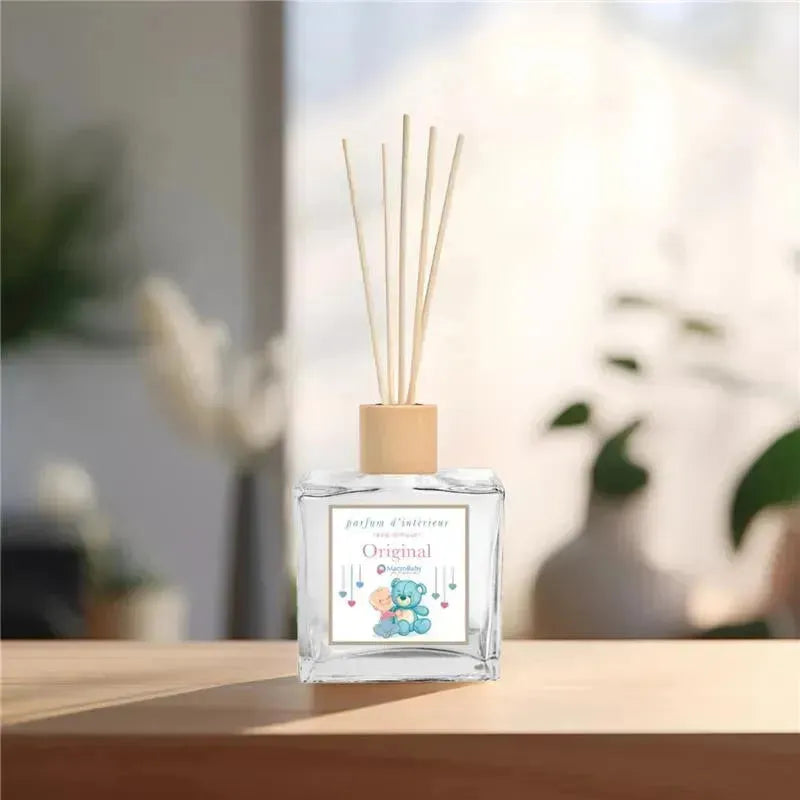 Reed diffuser from Macrobaby, 6.7 oz, packaged in a clear glass bottle with bamboo sticks and a colorful label.