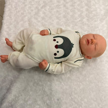 Macrobaby Reborn Doll, Jaxson Asleep 2, features white vinyl, painted hair, closed eyes, and a penguin-themed outfit.