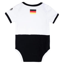 Germany-themed baby bodysuit featuring a white top with black shorts and a small German flag emblem on the back.