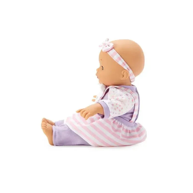 Soft baby doll in a unicorn jumper with a pink and purple striped dress and matching headband.