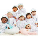 Madame Alexander Munchkin dolls with light skin tone, blue eyes, and brown hair, dressed in white onesies and caps.