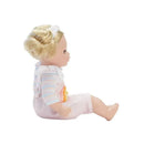Doll in pink rainbow overalls with striped sleeves and curled blonde hair, designed for imaginative play.