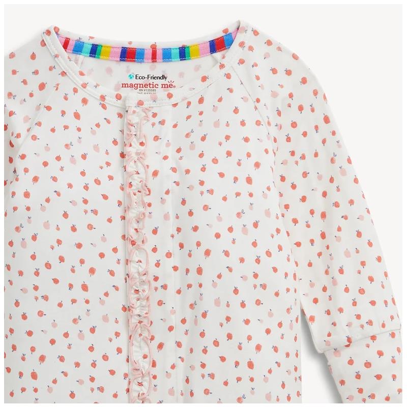 Ruffly convertible coverall by Magnetic Me, featuring a white background with small pink and red apple blossom patterns.