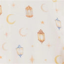 Cotton fabric featuring a whimsical pattern of lanterns, stars, and crescent moons for Ramadan.