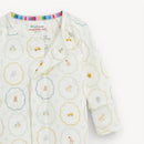 Cream modal convertible coverall with colorful nursery-themed prints, featuring toys, animals, and pastel colors.