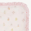 Pink baby blanket with a soft ruffled edge, featuring playful animal illustrations playing instruments.
