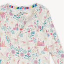 Modal convertible coverall featuring a colorful fairy-tale pattern with castles, unicorns, and flowers. Eco-friendly design.