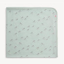 Teal modal blanket featuring a playful zebra print, designed for versatile use.