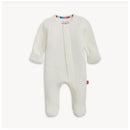 Tofu Waffle Footie in cream color, featuring long sleeves, front snap closure, and colorful striped neckline accents.