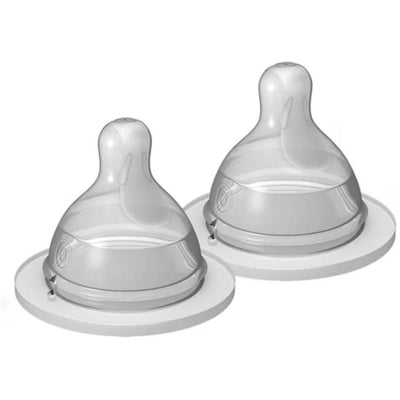 Two Mam extra slow flow nipples for babies, unisex, suitable for ages 0 months and older, displayed on a round base.