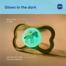 Glow-in-the-dark green pacifier featuring a cartoon horse and stars, ideal for easy nighttime visibility.