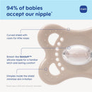 Silicone nipple pacifier with a curved shield, breast-like SkinSoft™ nipple, and dimples for reducing skin irritation.