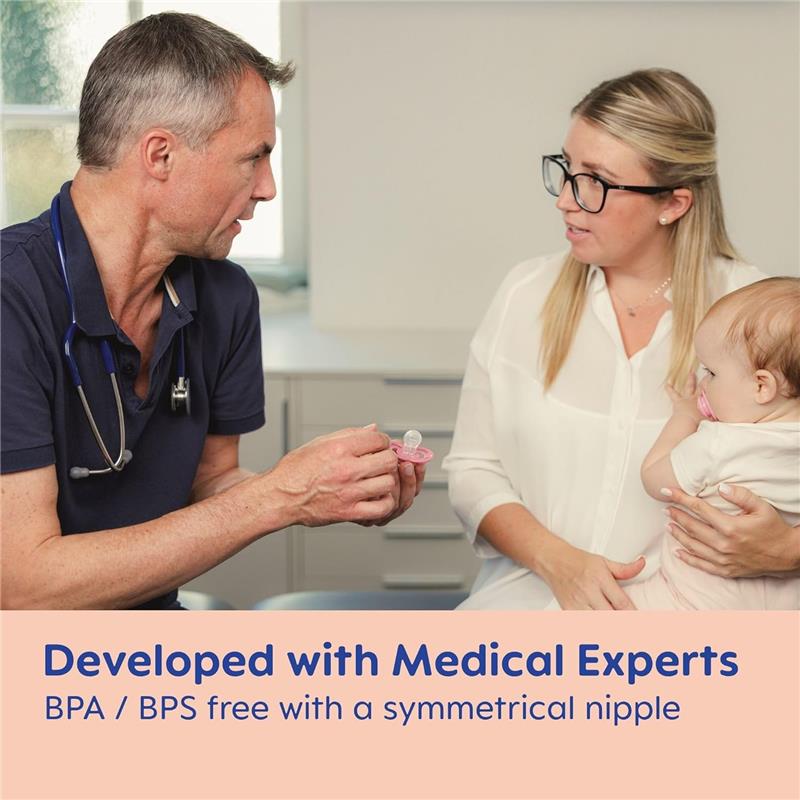 A doctor demonstrates the Mam 3Pk Original Day & Night Baby Pacifier to a mother holding her baby, highlighting its features.