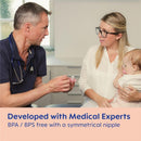 A doctor demonstrates the Mam 3Pk Original Day & Night Baby Pacifier to a mother holding her baby, highlighting its features.