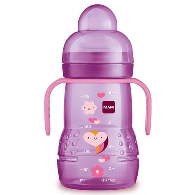 Trainer sippy cup with purple design, pink handles, measurement markings, and cheerful graphics, suitable for children 4 months and older.