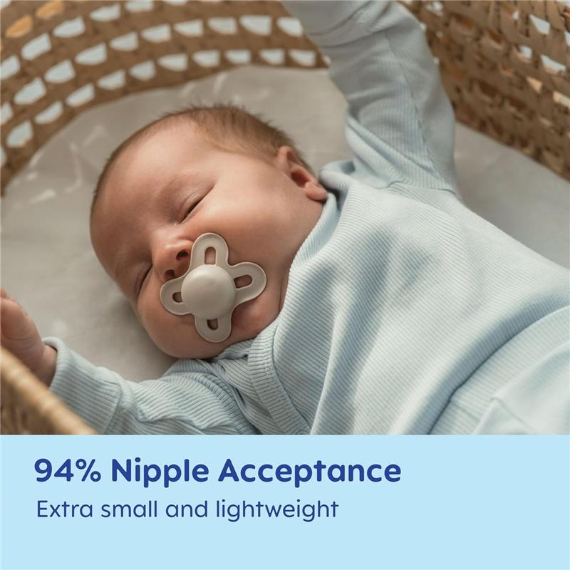 Baby sleeping in a crib with a Mam Original Start pacifier; features text highlighting 94% nipple acceptance and lightweight design.