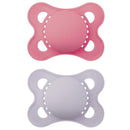 Two baby pacifiers in pink and lavender colors, designed for girls, suitable for infants 0 to 6 months.