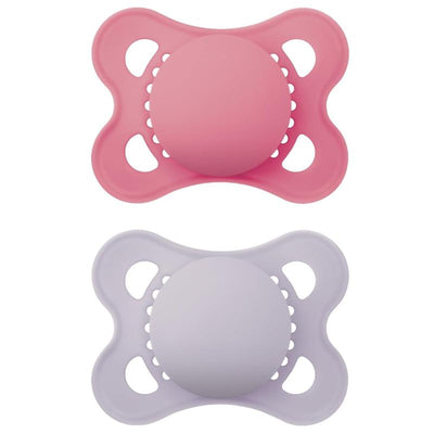 Two baby pacifiers in pink and lavender colors, designed for girls, suitable for infants 0 to 6 months.