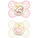 Two baby pacifiers designed for girls, featuring a pink bird and a cream fox on the nipple.