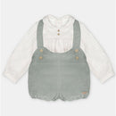 Two-piece set featuring a white shirt with a collared neckline and a green shorts overall with straps and button details.