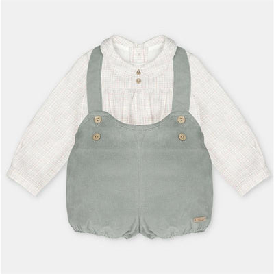 Two-piece set featuring a white shirt with a collared neckline and a green shorts overall with straps and button details.