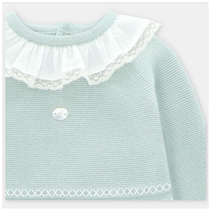 Light pink sweater featuring a lace-trimmed collar, a decorative button, and a textured knit design.