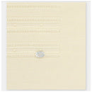 Knit baby blanket in soft cream color with textured stripes, featuring a small silver tag.