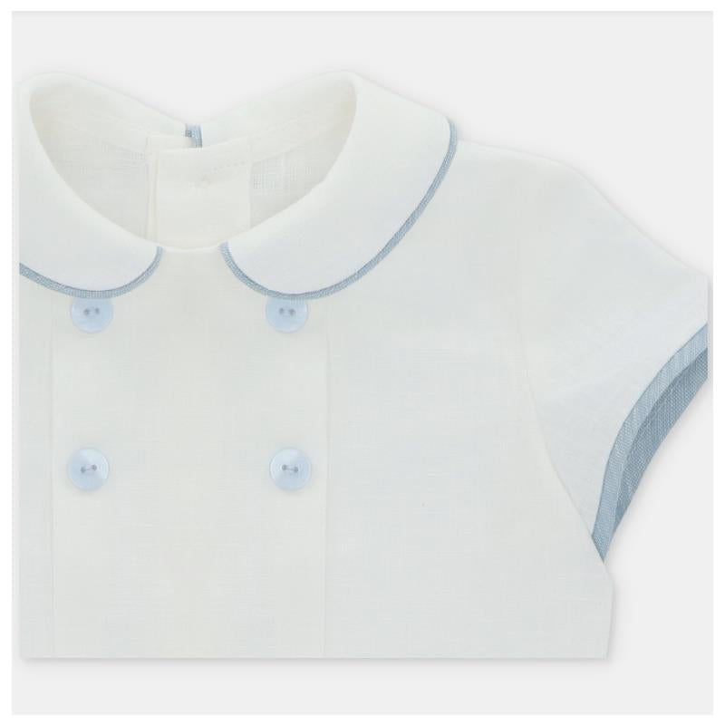 Baby boy shirt featuring a white fabric with a light blue collar and buttons, designed for the Martin Aranda set.