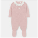 Baby pink long romper with feet, featuring a scalloped white collar and snap buttons at the bottom.