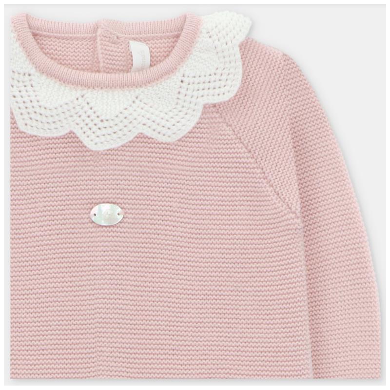 Baby pink long romper with feet, featuring a white crocheted collar and a decorative metal tag on the front.