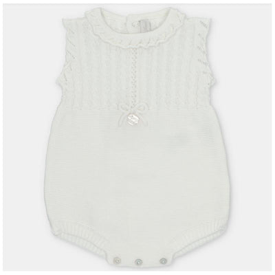 Light pink knitted short romper for baby girls, featuring a ruffled neckline and bow detail on the front.