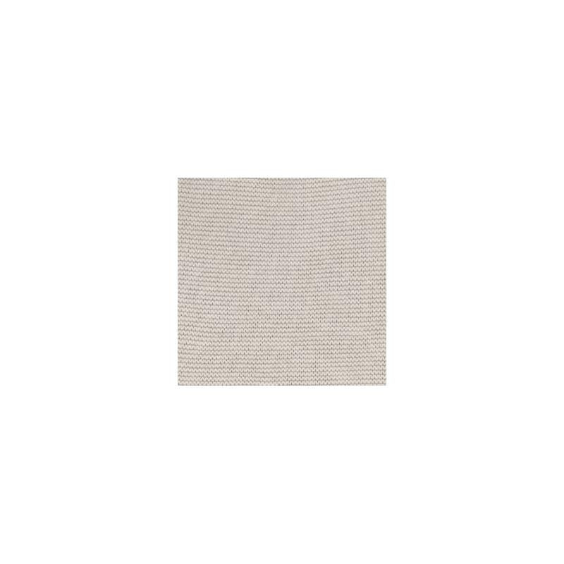 Beige knitted baby bonnet by Martin Aranda, featuring a soft texture and cozy design suitable for infants.