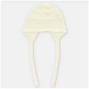 Light pink knit bonnet for babies featuring ear flaps and ties, designed for warmth and style.