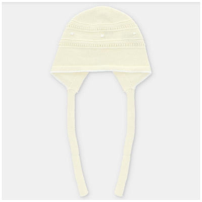 Light pink knit bonnet for babies featuring ear flaps and ties, designed for warmth and style.