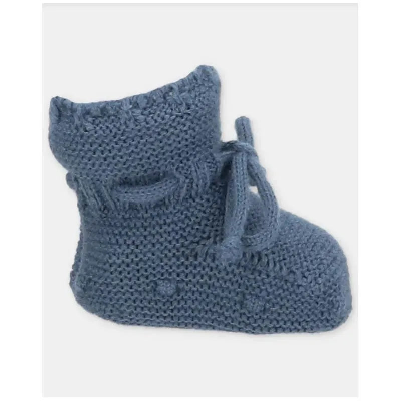 Light blue knitted baby booties with a tied bow detail, designed for comfort and warmth.
