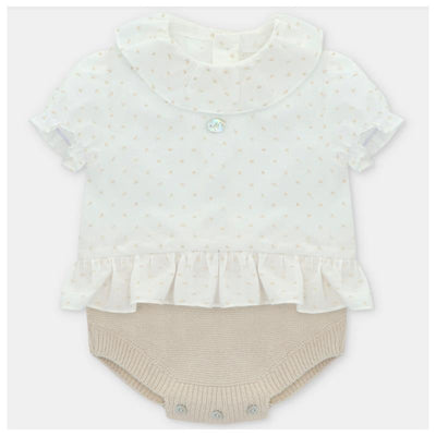 Baby short romper by Martin Aranda in Volterra, Arena with a white dotted top and beige knitted bottom.